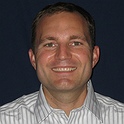 Travis-Intel_headshot.jpeg.124x124_q96_box-0,0,1400,1400_crop_detail